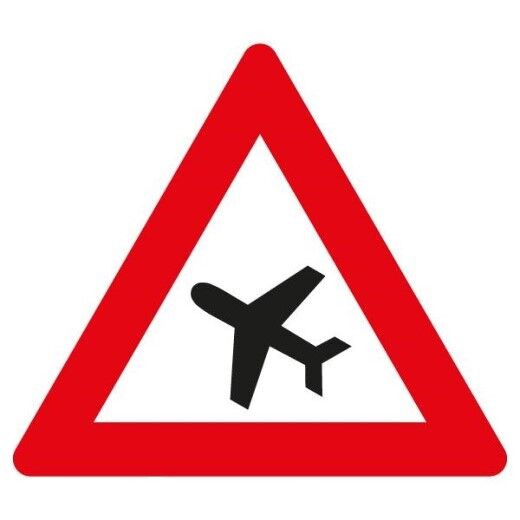 Verkehrsschild mit rotem Dreieck und schwarzem Flugzeug, das auf Flugbetrieb hinweist.