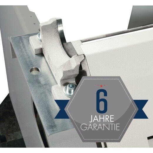 Maschinendetail mit Gusslager und „6 Jahre Garantie“-Symbol.